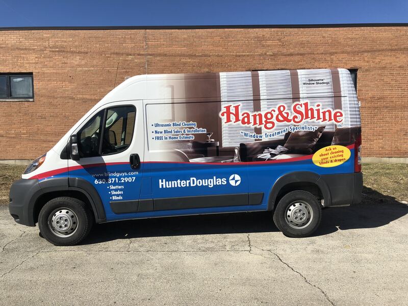 The Hang and Shine van parked outside a job